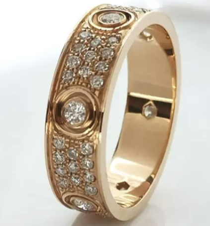 Anillo Cartier Love oro rosa con piedras centrales