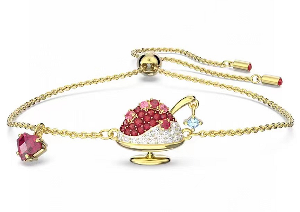 Brazalete dorado dije fresa cristales rojos