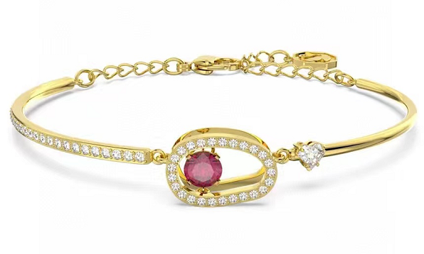 Brazalete dorado óvalo cristal rosa y corazón