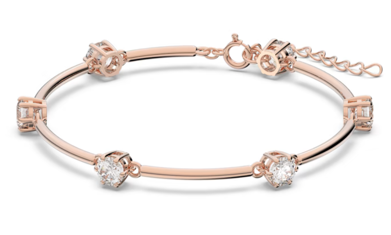 Brazalete Constella rígido cristales blancos tono oro rosa