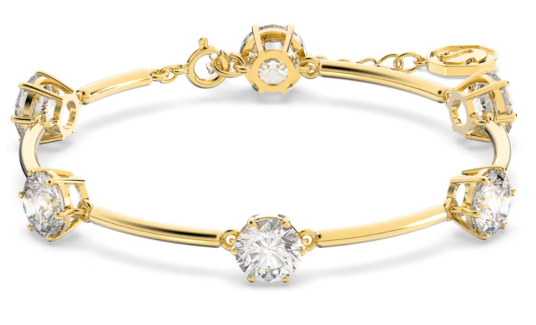 Brazalete Constella rígido cristales blancos tono dorado