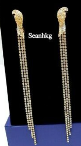 Aretes Swarovski águila flecos largos dorado