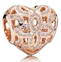 Charm corazón calado circonias baño oro rosa